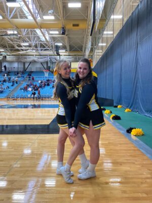 Hailey Vader in cheer outfit with friend